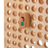 wooden light switch toy on activity board